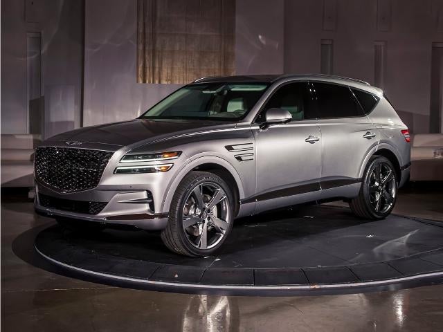 2024 Genesis GV80 2.5T AWD in Makalu Gray — front three-quarter view
